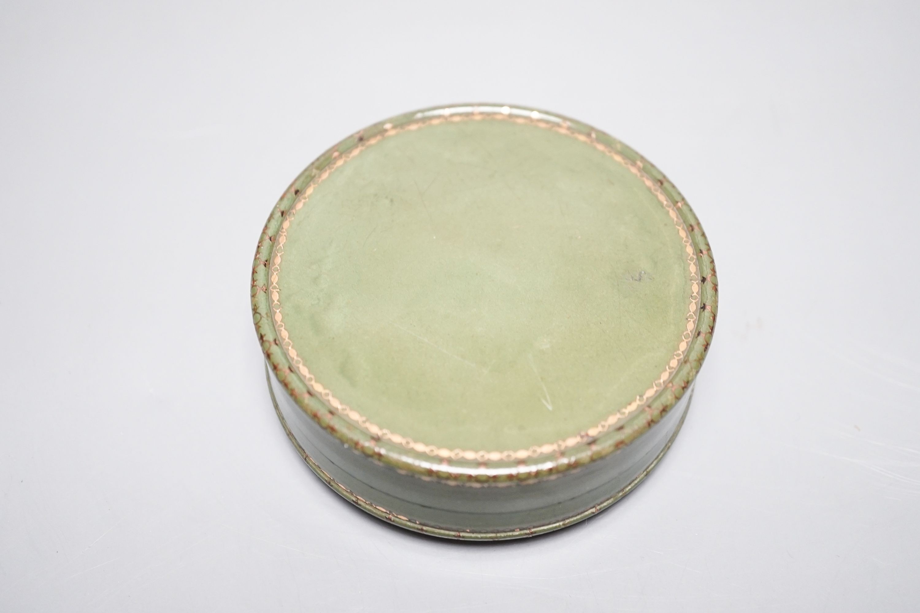 An early 19th century portrait miniature inset green japanned box, 8.3cm diameter